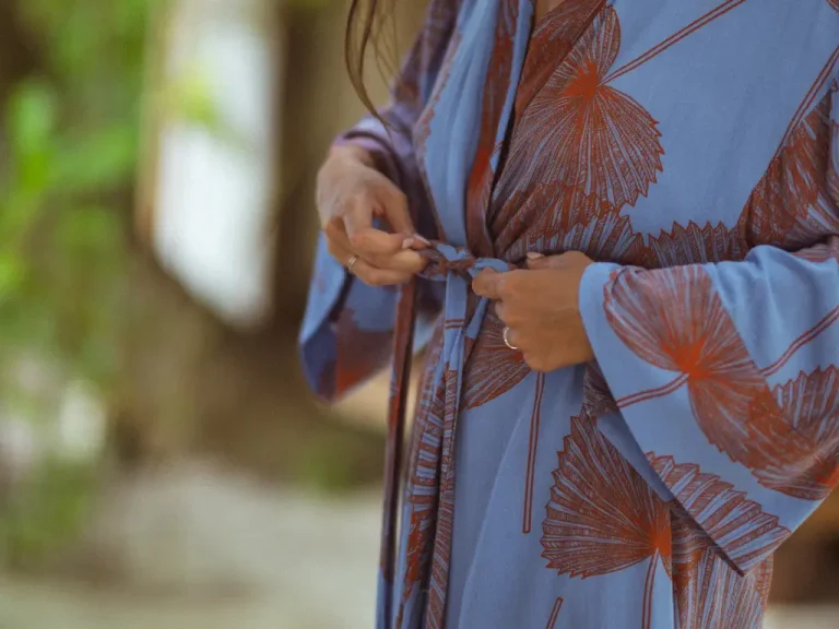 Calm Afternoons in the Mentawais - a person is tying their robe